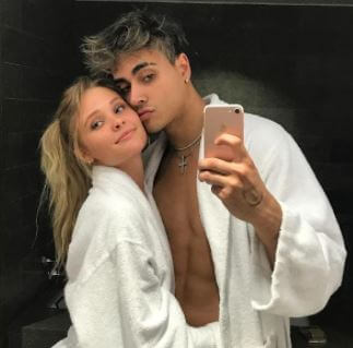 Madeline Damskey with her boyfriend Darius Dobre taking a mirror selfie.